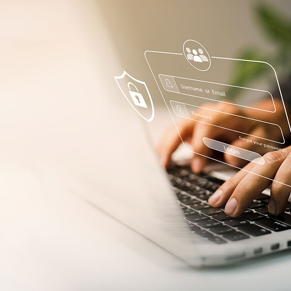 fingers typing on laptop