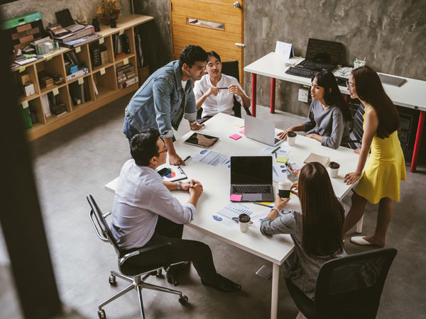 Employees brainstorming around a table