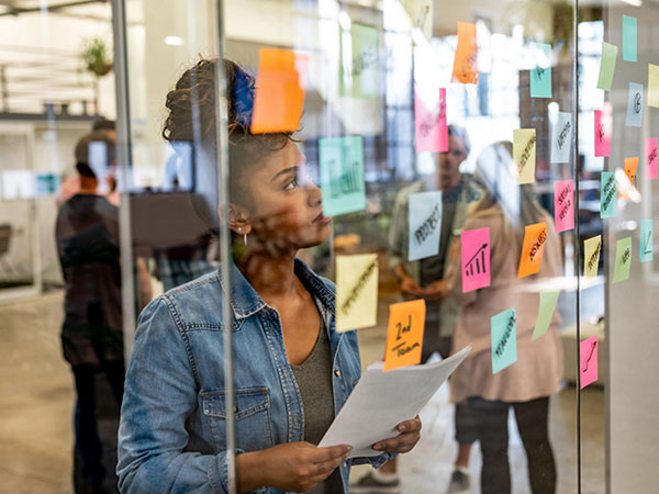 Thoughtful woman brainstorming at a creative office