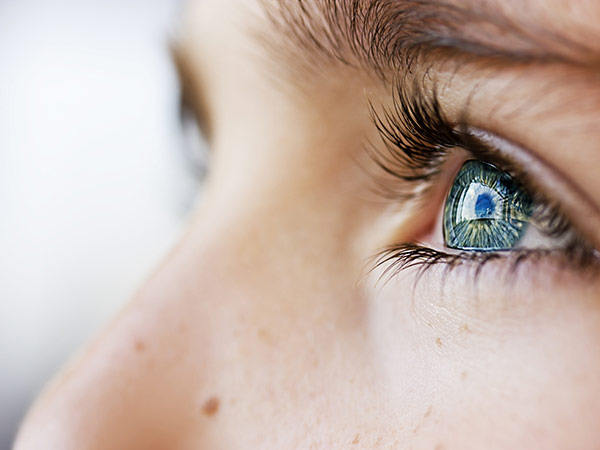 Close up of a woman’s eyes looking up