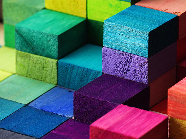 Stacked wood blocks in multiple bright colors