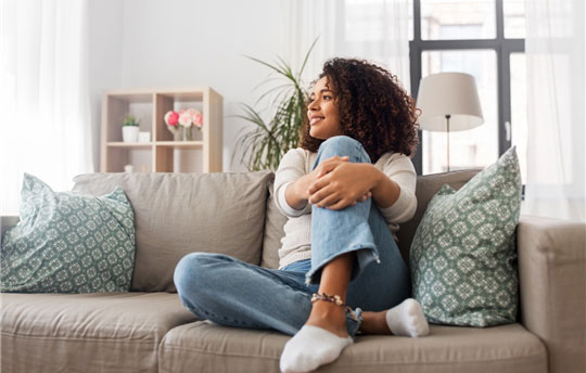 A relaxed woman happy about her health insurer's services