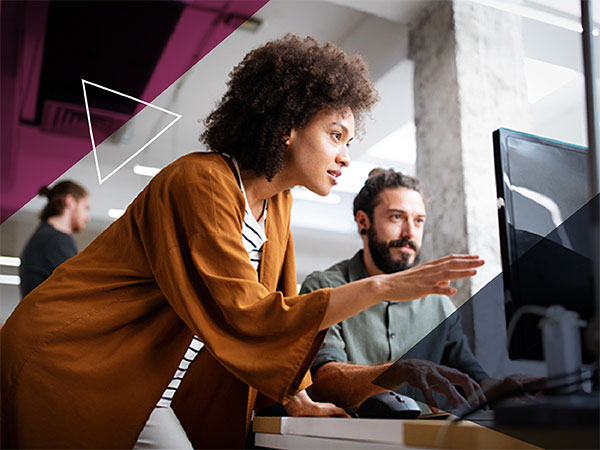 Woman pointing to computer monitor screen