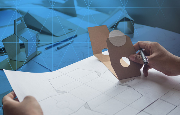 someone sketching packaging designs.