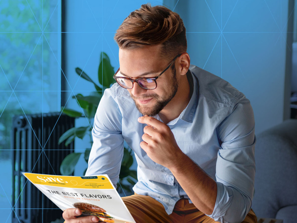 Man reading a promotional flyer