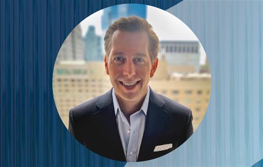 Andy Johnson on a blue background