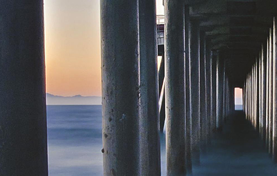 the tunnel stilts under a pier make at low tide