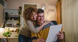 Mom and son celebrate good news college admission via mail