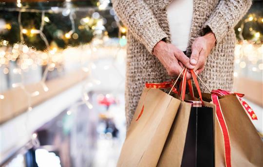 Senior woman with bags doing holiday shopping