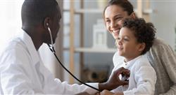 pediatrician holds stethoscope to exam child patient