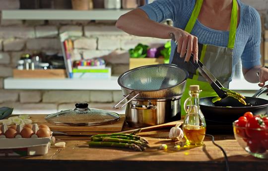 woman cooking, stovetop