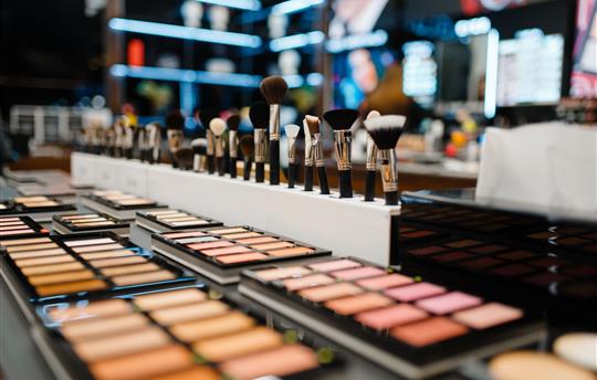 Showcase with powder and shadows, cosmetics store