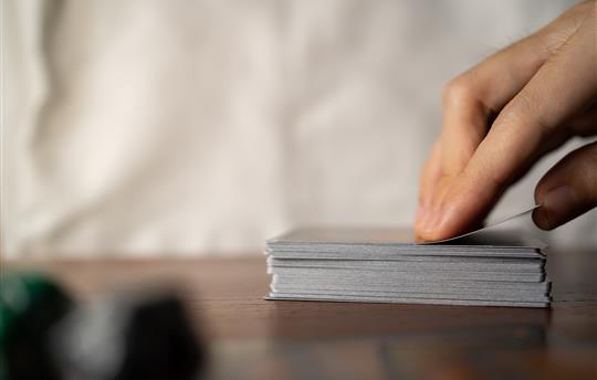 hand on deck of cards