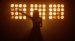female singer on stage, silhouette