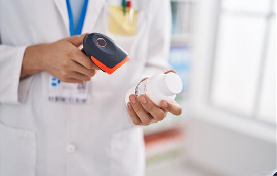 pharmacist scanning pharma label