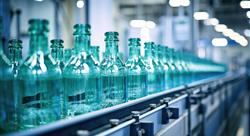 Glass bottles on production conveyor belt