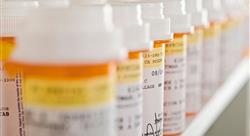 close-up of orange prescription bottles lined up