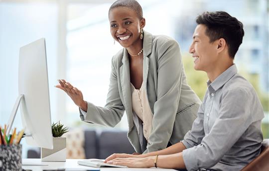 smiling marketers reviewing first-party data