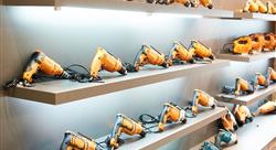 hardware store display shelf filled with orange power drills