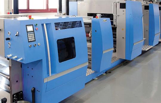 row of large blue and silver commercial print machines