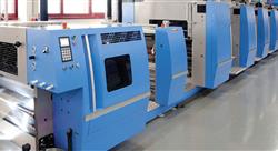 row of large blue and silver commercial print machines