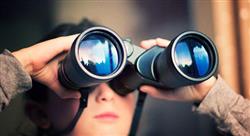 young boy looking through large binoculars