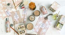 Assortment of floral-printed packaging for candles, oils and lotions