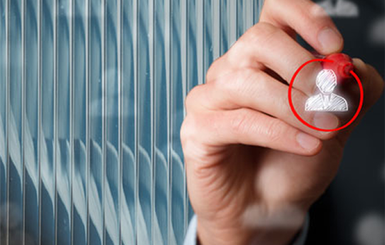 Hand with red marker circling a person icon