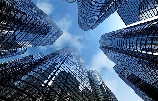 View looking up at the sky and reflective skyscrapers