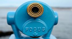 Blue telescope viewer with word "FOCUS" on it