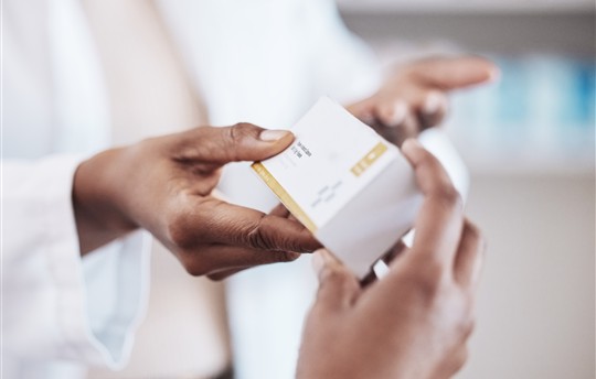 Pharmacist, medicine or hands of customer with pills, supplements or box for wellness or help. 