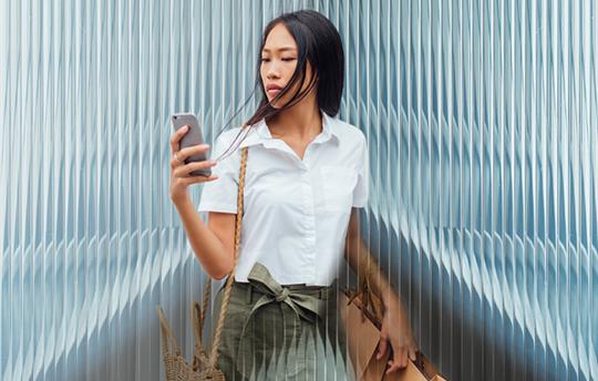 Young woman looking at her phone