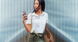 Young woman looking at her phone