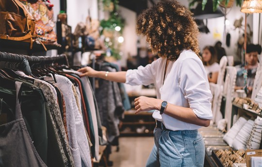 woman shopping for clothes at retailer 