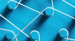 white string wrapped around blue pegs