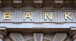 The word bank in gold on the front of a building